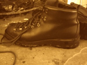 danner boot by fireplace